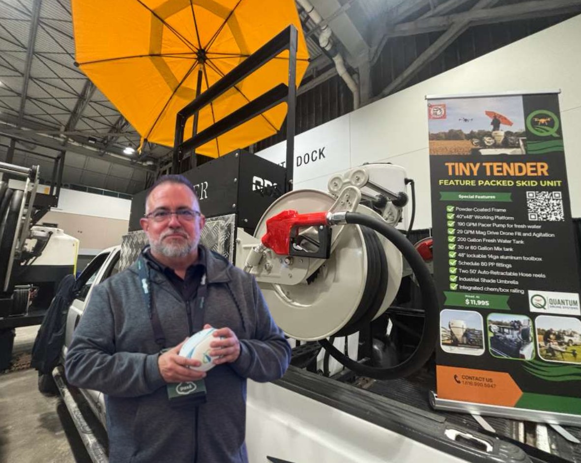 Quantum Drone Systems Tiny Tender skid unit mounted in pickup truck bed at agricultural drone trade show